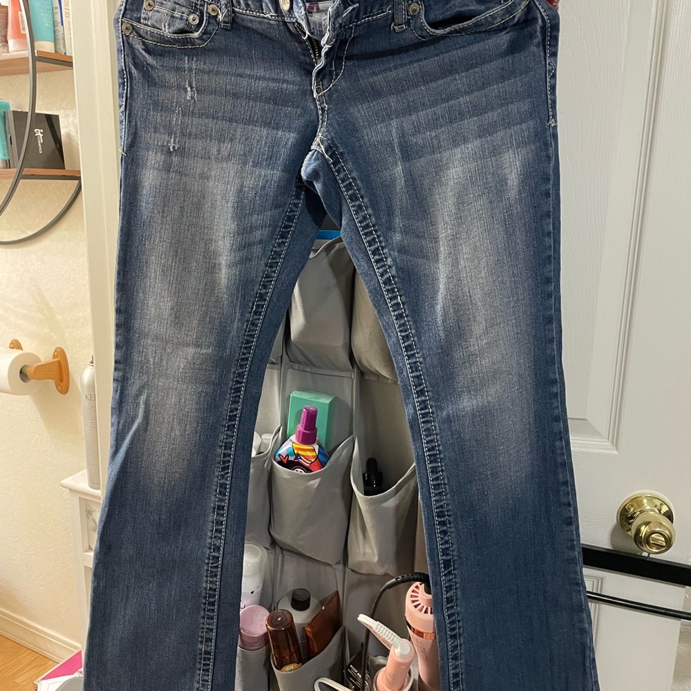 Maurices size 3, regular or boot, cut, distressed blue jeans.